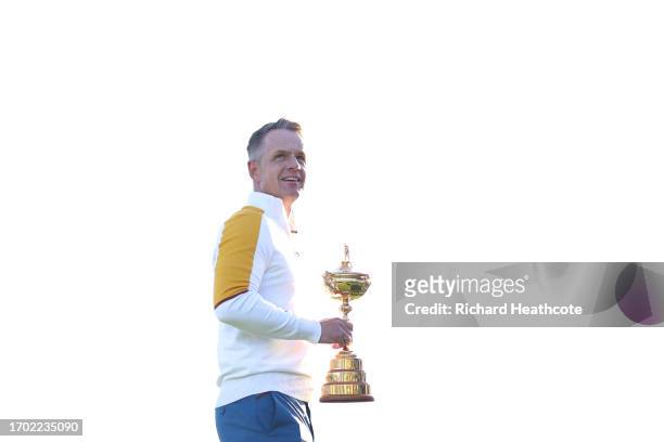 Luke Donald, Captain of Team Europe holds the Ryder Cup Trophy during the European Team Portraits at the 2023 Ryder Cup at Marco Simone Golf Club on...