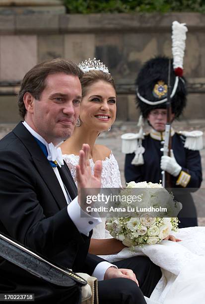 Christopher O'Neill and Princess Madeleine of Sweden leave the Royal Palace and Chapel ceremony in the carriage cortege after their wedding hosted by...