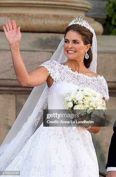 Princess Madeleine of Sweden greet the public after their wedding ceremony hosted by King Carl Gustaf XIV and Queen Silvia at The Royal Palace on...