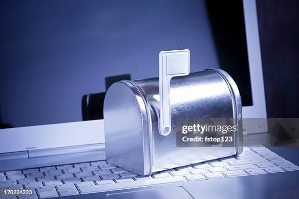 you've got mail. miniature silver mailbox on white laptop. - junk mail stock pictures, royalty-free photos & images