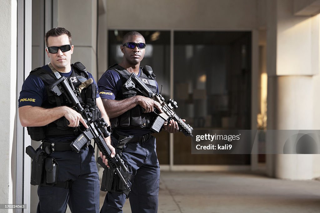 Police officers with rifles