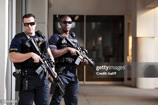 police officers with rifles - guarding building stock pictures, royalty-free photos & images