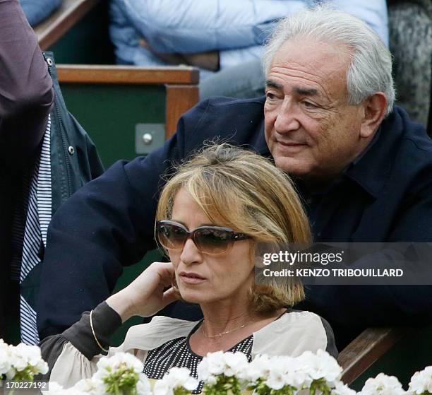 Former IMF chief Dominique Strauss-Kahn and his partner, Media Marketing Executive Myriam L'Aouffir attend the 2013 French tennis Open final at the...