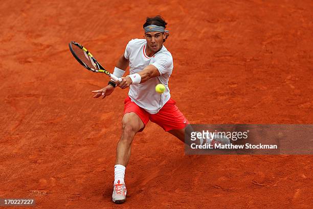 Rafael Nadal of Spain plays a backhand during the Men's Singles final match against David Ferrer of Spain on day fifteen of the French Open at Roland...
