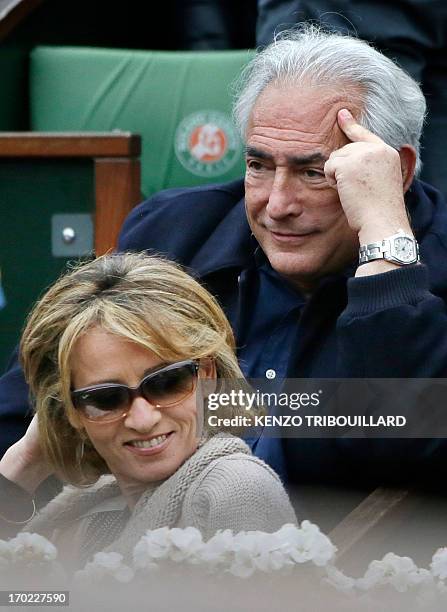 Former IMF chief Dominique Strauss-Kahn and his partner, Media Marketing Executive Myriam L'Aouffir attend the 2013 French tennis Open final at the...