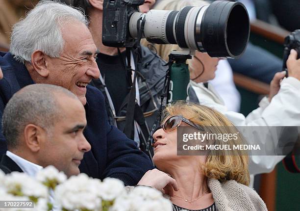 Former IMF chief Dominique Strauss-Kahn and his partner, Media Marketing Executive Myriam L'Aouffir attend the 2013 French tennis Open final at the...
