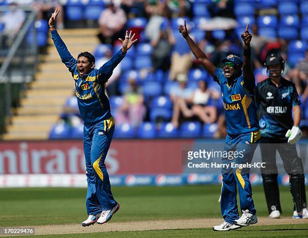 Tillakaratne Dilshan and Angelo Mathews of Sri Lanka appeal successfully for the wicket of James Franklin of New Zealand during the ICC Champions...