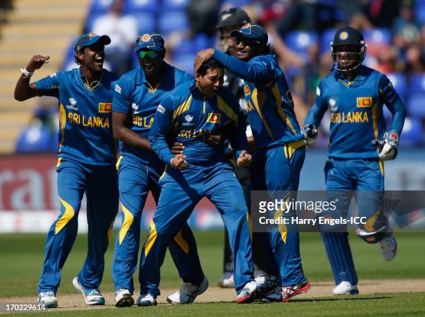 Tillakaratne Dilshan of Sri Lanka celebrates with teammates after dismissing James Franklin of New Zealand during the ICC Champions Trophy group A...