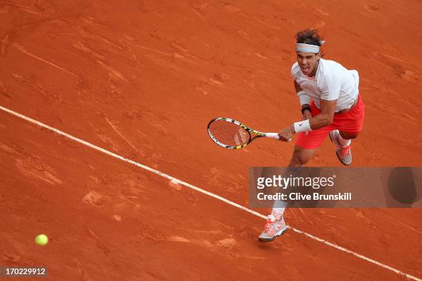 Rafael Nadal of Spain serves during the Men's Singles final match against David Ferrer of Spain on day fifteen of the French Open at Roland Garros on...