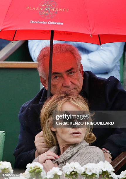 Former IMF chief Dominique Strauss-Kahn and his partner, Media Marketing Executive Myriam L'Aouffir attend the 2013 French tennis Open final at the...