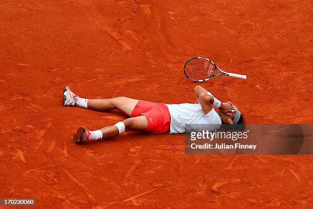 Rafael Nadal of Spain celebrates match point during the Men's Singles final match against David Ferrer of Spain on day fifteen of the French Open at...
