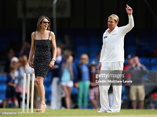 Elizabeth Hurley and Shane Warne look on during the Shane Warne's Australia vs Michael Vaughan's England T20 match at Circenster Cricket Club on June...