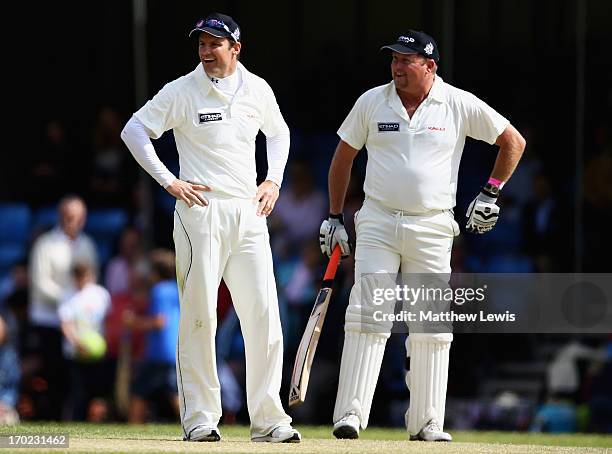 Andrew Strauss of Michael Vaughan's England looks on with David Saker of Shane Warne's Australia team during the Shane Warne's Australia vs Michael...