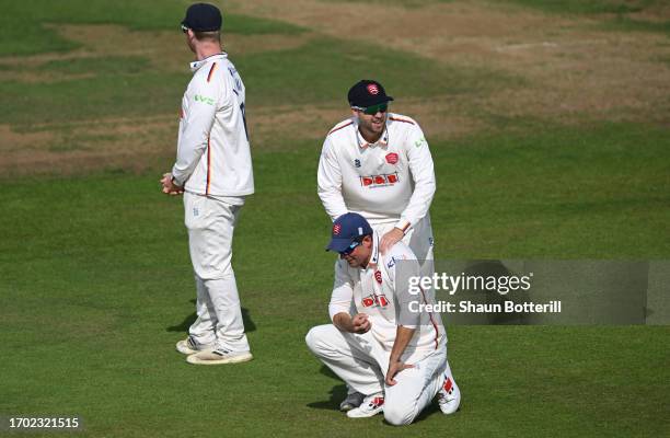 Sir Alastair Cook of Essex with teammate Matthew Critchley during the LV= Insurance County Championship Division 1 match between Northamptonshire and...