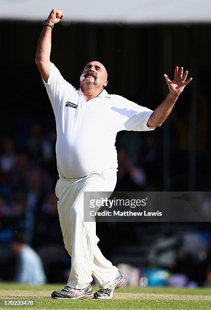 Merv Hughes of Shane Warne's Australia celebrates his hat trick wicket, after bowling Mark Nicholas of Michael Vaughan's England for LBW during the...
