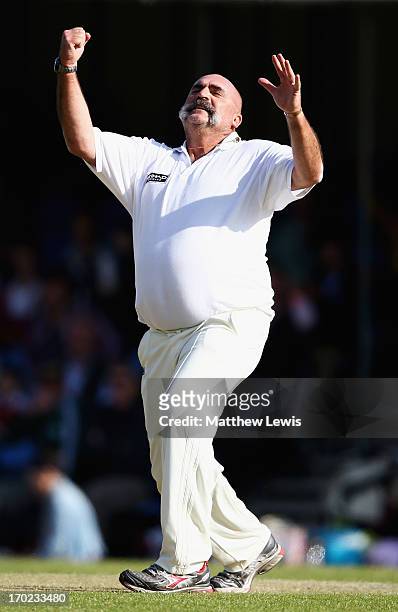 Merv Hughes of Shane Warne's Australia celebrates his hat trick wicket, after bowling Mark Nicholas of Michael Vaughan's England for LBW during the...
