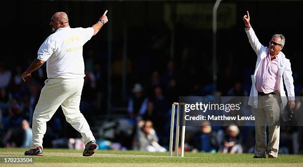 Umpire Allan Lamb awards Merv Hughes of Shane Warne's Australia his hat trick wicket, after bowling Mark Nicholas of Michael Vaughan's England for...