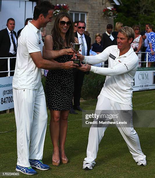 Michael Vaughan, captain of Michael Vaughan's England and Shane Warne, captain of Shane Waren's Australia are presented with the trophy by Elizabeth...