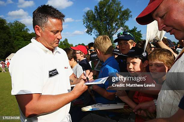 Darren Gough of Michael Vaughan's England signs autographs after the Shane Warne's Australia vs Michael Vaughan's England T20 match at Circenster...