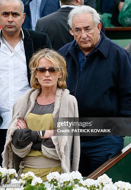 Former IMF chief Dominique Strauss-Kahn and his partner Media Marketing Executive Myriam L'Aouffir attend the trophy ceremony following the 2013...