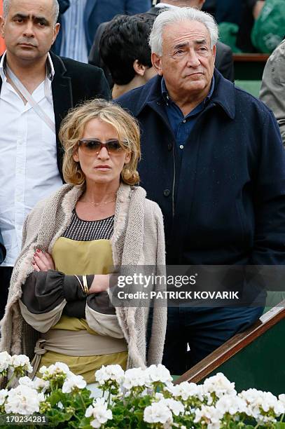 Former IMF chief Dominique Strauss-Kahn and his partner Media Marketing Executive Myriam L'Aouffir attend the trophy ceremony following the 2013...