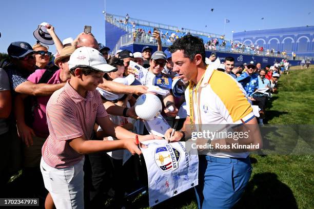 Rory McIlroy of Team Europe signs autographs for fans h18during a practice round prior to the 2023 Ryder Cup at Marco Simone Golf Club on September...