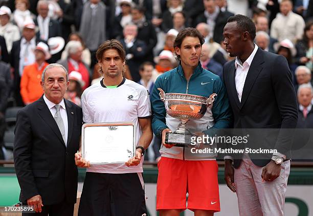 Runner up David Ferrer of Spain, winner Rafael Nadal of Spain and Olympic champion Usain Bolt pose after the mens' singles final during day fifteen...