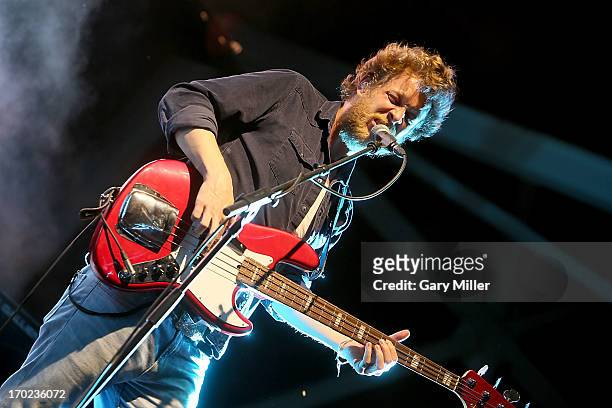 Ted Dwane performs in concert with Mumford & Sons at the Austin 360 Amphitheater on June 8, 2013 in Austin, Texas.