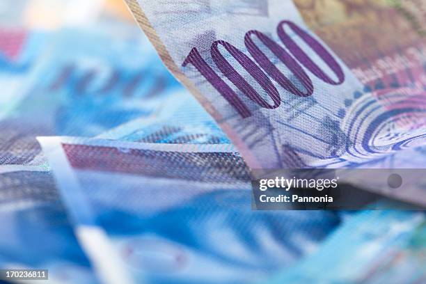 swiss francs close-up - franken stockfoto's en -beelden