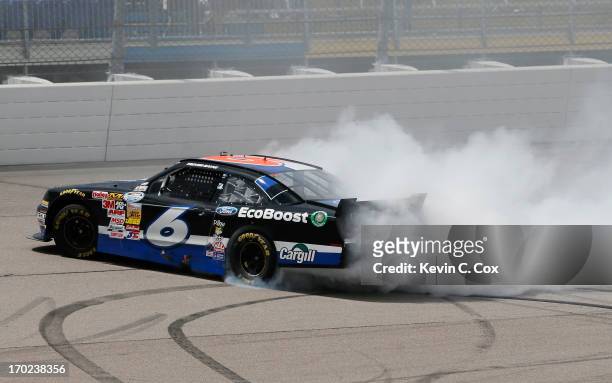 Trevor Bayne, driver of the Ford EcoBoost Ford, celebrates winning the NASCAR Nationwide Series DuPont Pioneer 250 at Iowa Speedway on June 9, 2013...