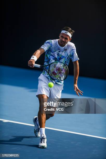 Daniel Altmaier of Germany returns a shot in the Men's Singles 1st Round Qualifying match against Lloyd Harris of South Africa on day one of 2023...