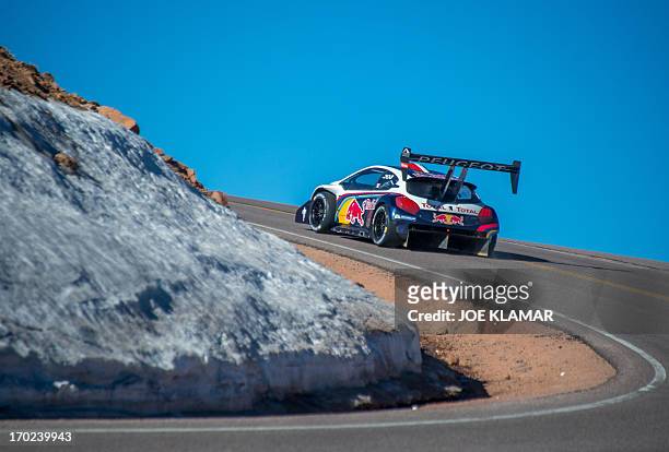 Nine-time WRC world champion Sebastien Loeb of France tries out his Peugeot 208 T16 to the top of Pikes Peak mountain as he prepares for the June 30...