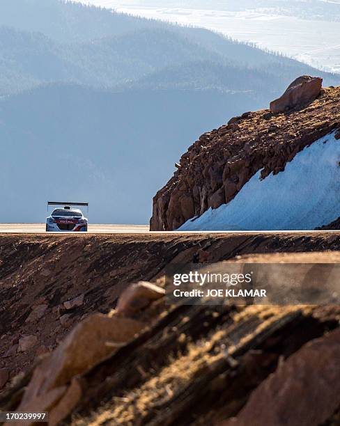 Nine-time WRC world champion Sebastien Loeb of France tries out his Peugeot 208 T16 to the top of Pikes Peak mountain as he prepares for the June 30...