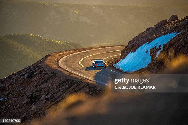 Nine-time WRC world champion Sebastien Loeb of France tries out his Peugeot 208 T16 to the top of Pikes Peak mountain as he prepares for the June 30...