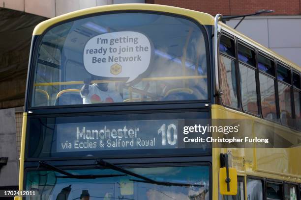 Bee Network bus makes its way through Manchester city centre on September 26, 2023 in Manchester, England. The new publicly-owned bus network is...
