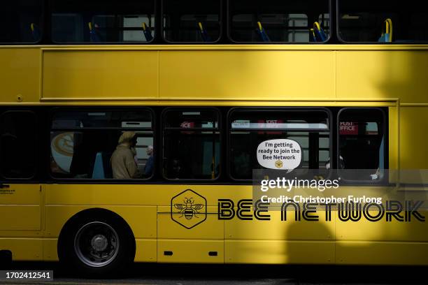 Bee Network bus makes its way through Manchester city centre on September 26, 2023 in Manchester, England. The new publicly-owned bus network is...