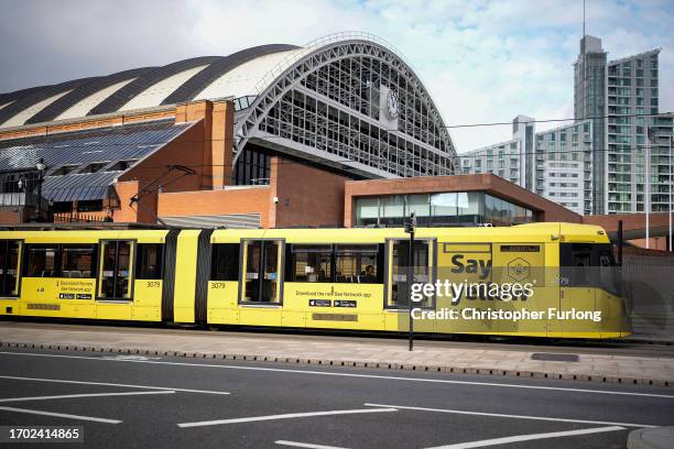 Bee Network tram makes its way through Manchester city centre on September 26, 2023 in Manchester, England. The new publicly-owned bus network is...