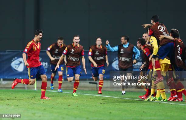 Alvaro Morata of Spain celebrates his team's winning goal with team mates during the UEFA European U21 Champiosnship Group B match between Germany...