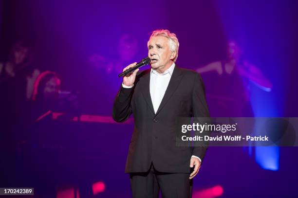 Michel Sardou performs at L'Olympia on June 9, 2013 in Paris, France.