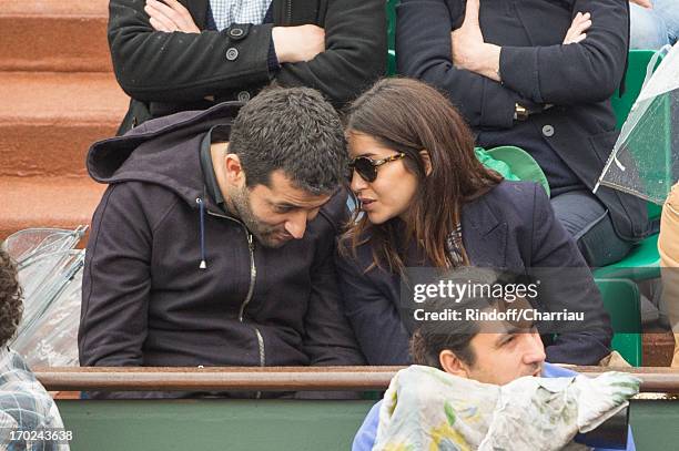 Leila Bekhti and guest sighting at the french open 2013 at Roland Garros on June 9, 2013 in Paris, France.