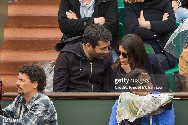 Leila Bekhti and guest sighting at the french open 2013 at Roland Garros on June 9, 2013 in Paris, France.