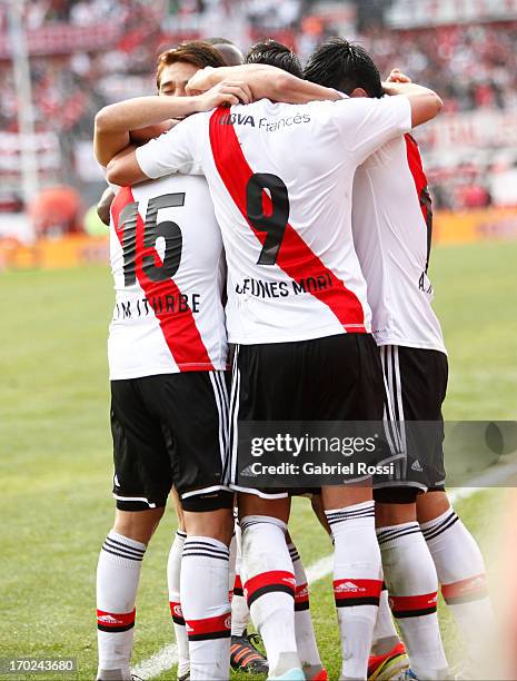 Players of River Plate celebrate a goal during a match between River Plate and Independiente as part of the Torneo Final 2013 at the Monumental...