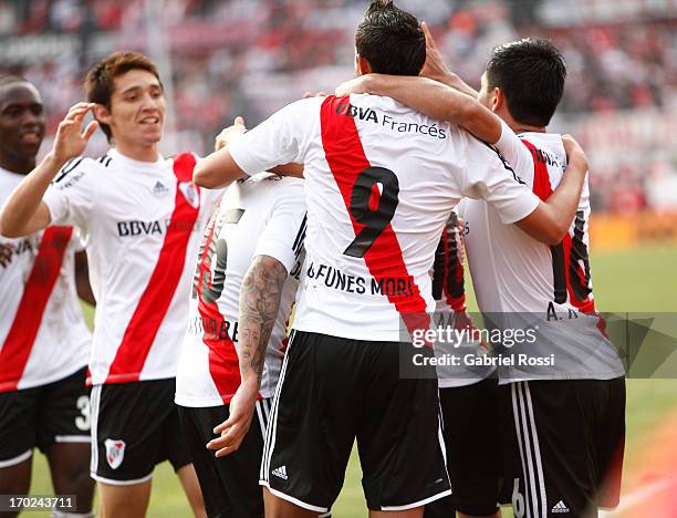 Players of River Plate celebrate a goal during a match between River Plate and Independiente as part of the Torneo Final 2013 at the Monumental...