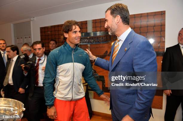 Winner of Rolland Garros 2013 Rafael Nadal is congratulated by Prince Felipe of Spain after the Final of Roland Garros Tennis French Open 2013 - Day...