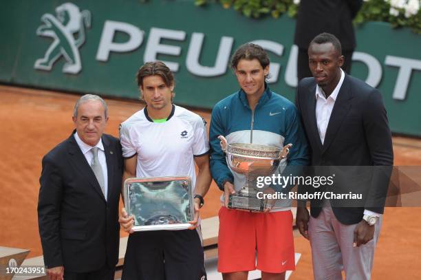 Jean Gachassin, David Ferrer, Rafael Nadal and Usain Bolt pose after the final match of french open 2013 at Roland Garros on June 9, 2013 in Paris,...