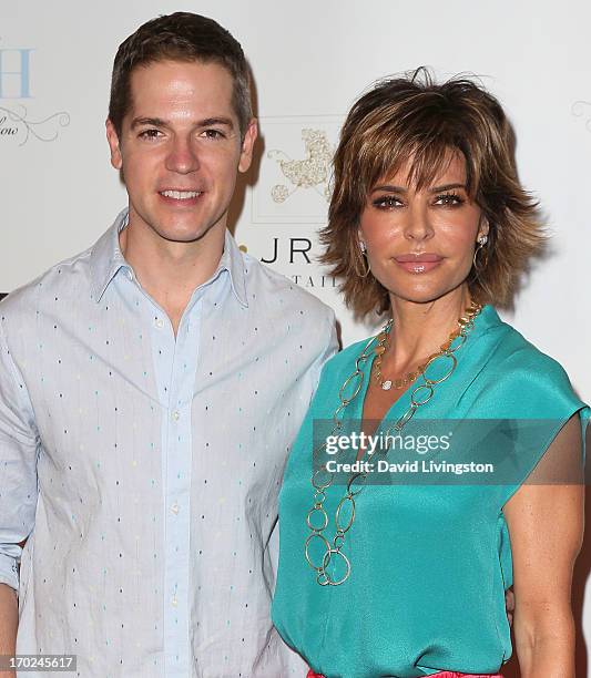 Host Jason Kennedy and actress Lisa Rinna attend the 2013 Plush Show at the Hyatt Regency Century Plaza on June 9, 2013 in Century City, California.