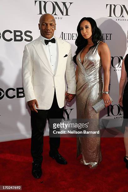 Former boxer/actor Mike Tyson and Kiki Tyson attend The 67th Annual Tony Awards at Radio City Music Hall on June 9, 2013 in New York City.
