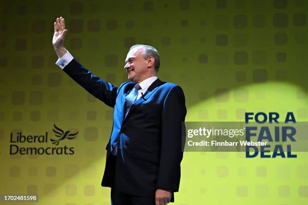Sir Ed Davey, leader of the Liberal Democrats, waves on stage after delivering his keynote speech during the Liberal Democrat conference at...
