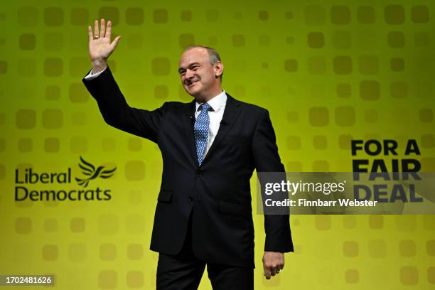 Sir Ed Davey, leader of the Liberal Democrats, waves on stage after delivering his keynote speech during the Liberal Democrat conference at...