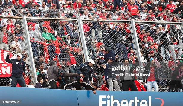 Supporters of Independiente react after a match between River Plate and Independiente as part of the Torneo Final 2013 at the Monumental Vespusio...